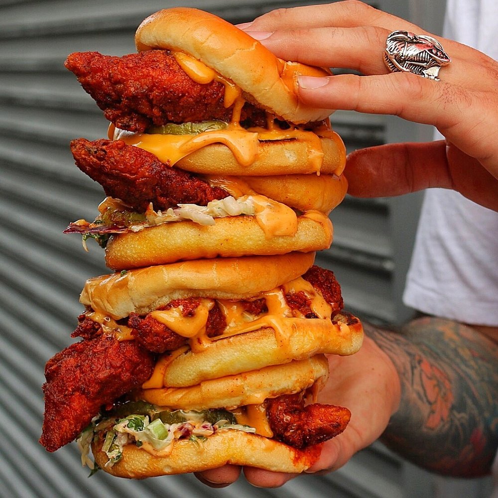 Four Dave’s Hot Chicken sliders stacked together